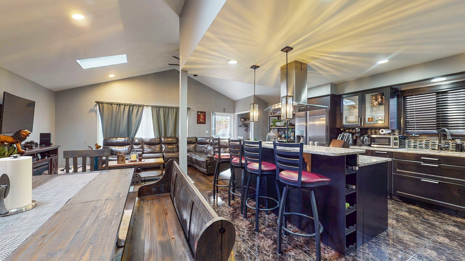 8129 45th Place Lyons, IL 60534 - Photo 17 of 45 a very nice looking open dining room with kitchen island furniture a chandelier a large window and kitchen view