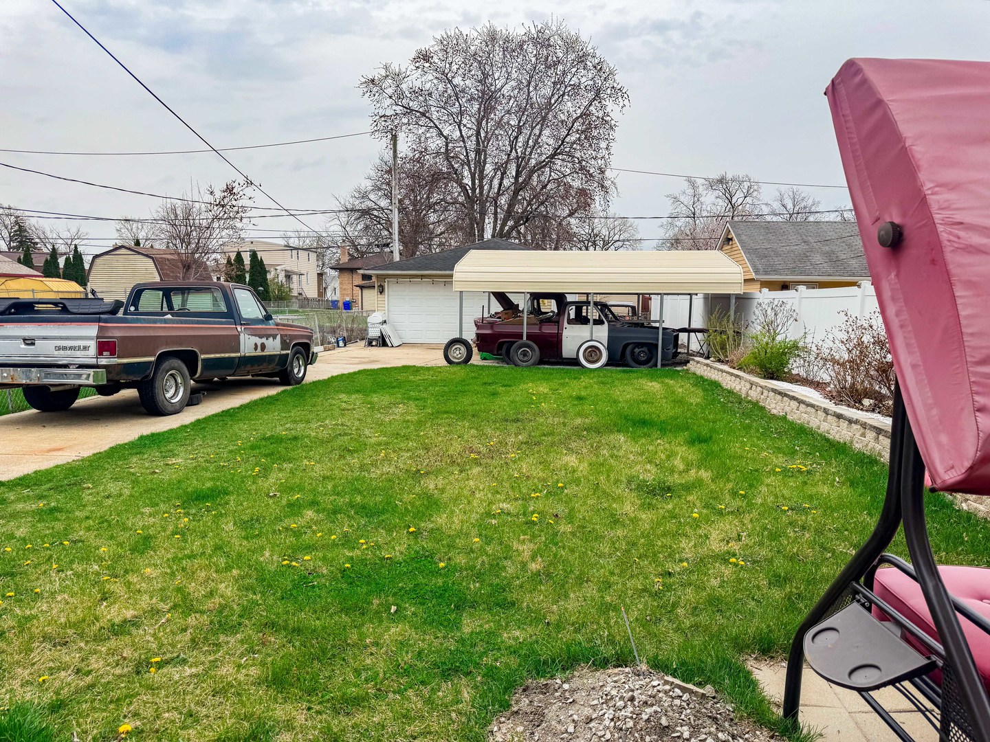 8129 45th Place Lyons, IL 60534 - Photo 2 of 45 a view of a big house with a big yard and large trees