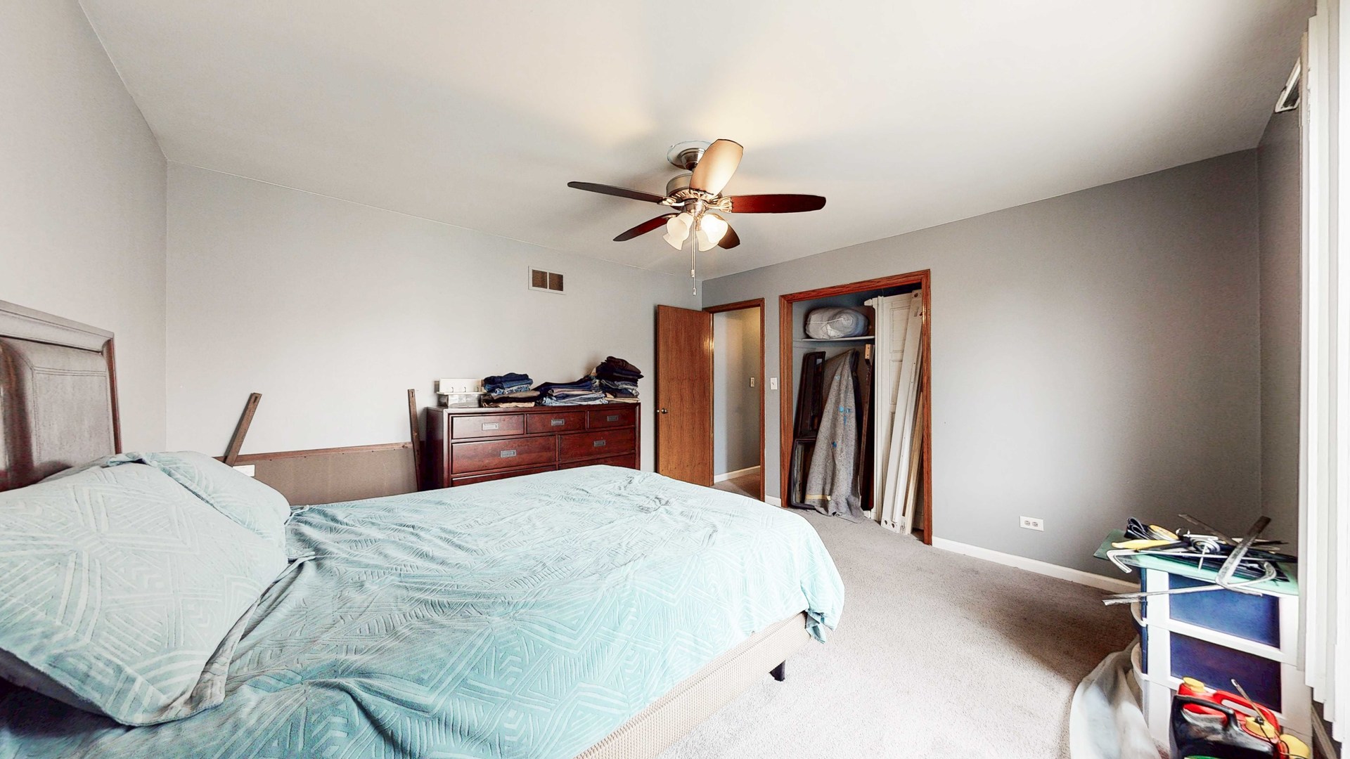 8129 45th Place Lyons, IL 60534 - Photo 29 of 45 a bedroom with a bed and a chandelier