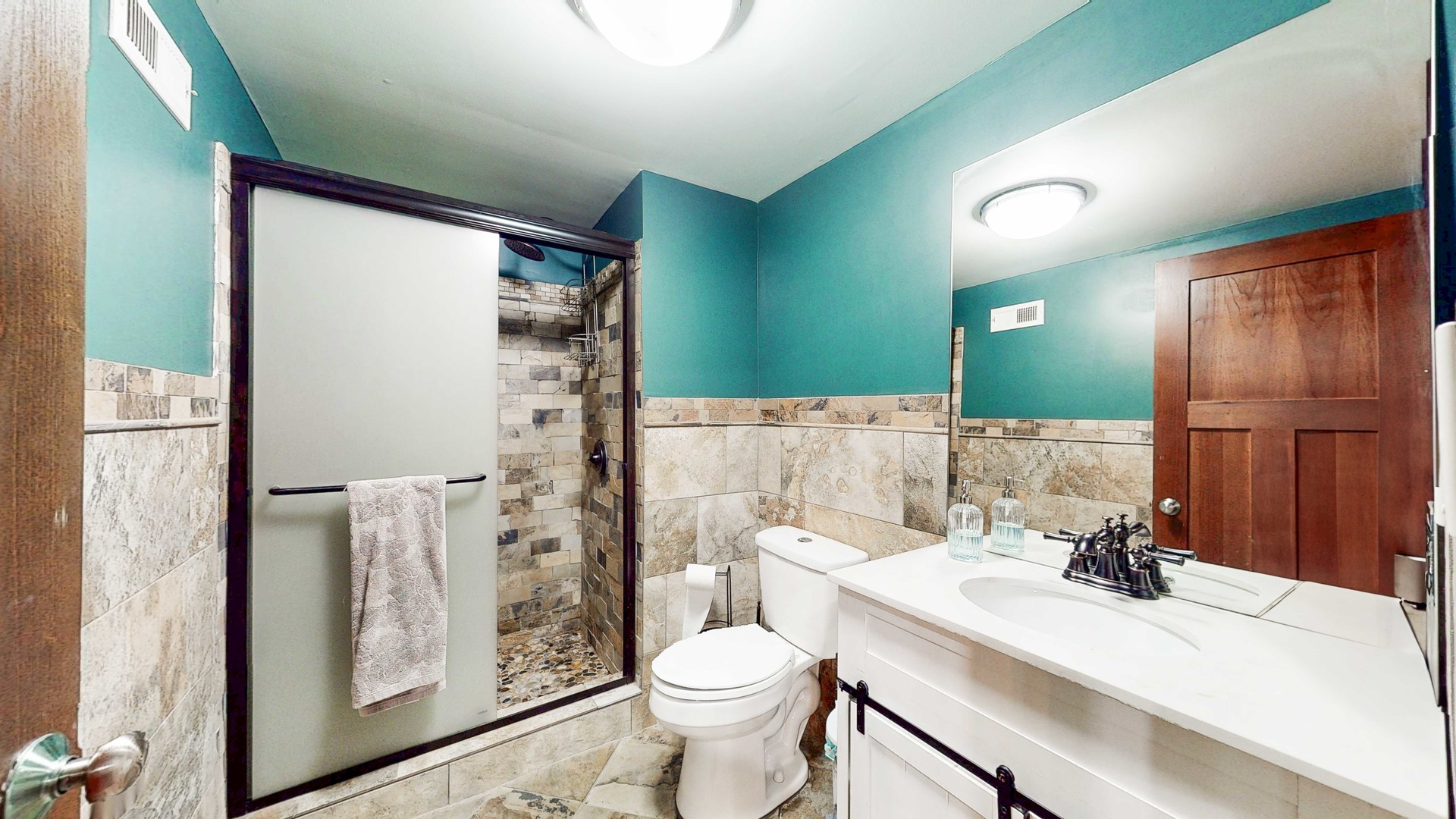 8129 45th Place Lyons, IL 60534 - Photo 45 of 45 a bathroom with a sink a toilet and shower