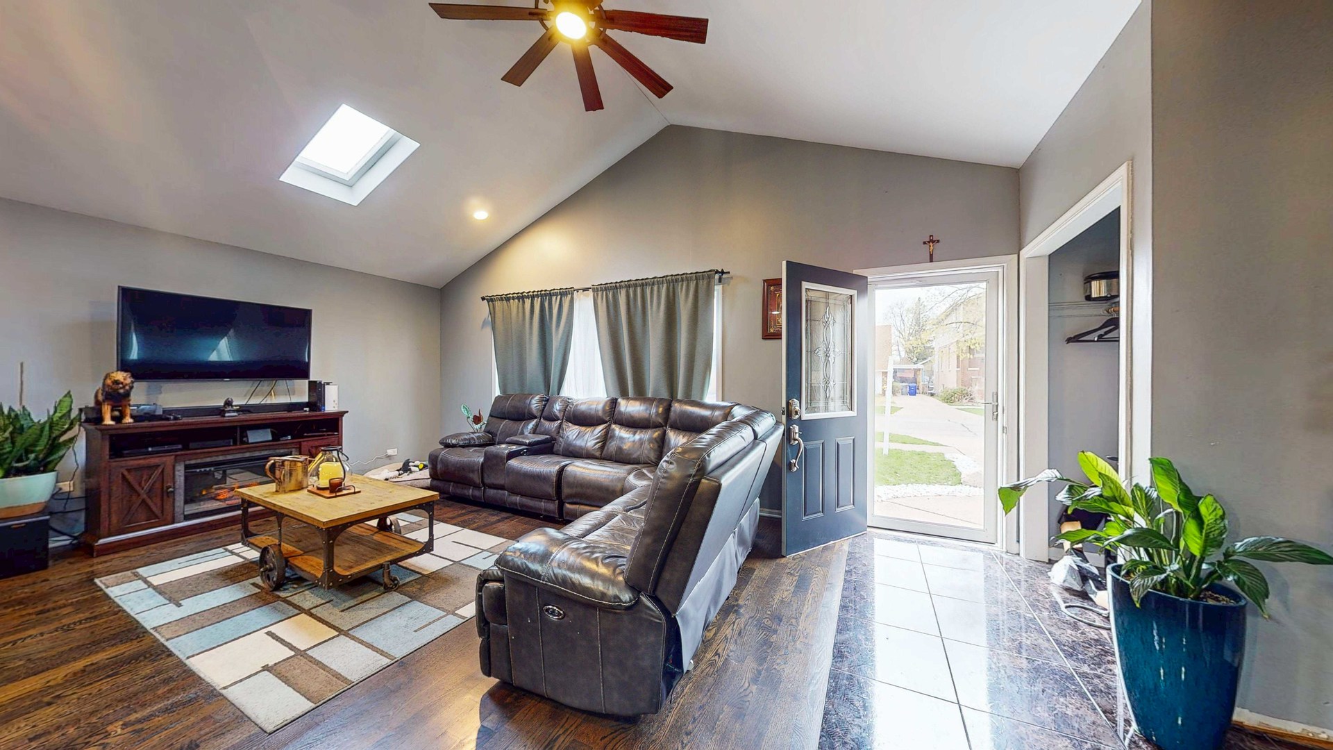 8129 45th Place Lyons, IL 60534 - Photo 8 of 45 a living room with furniture and a flat screen tv