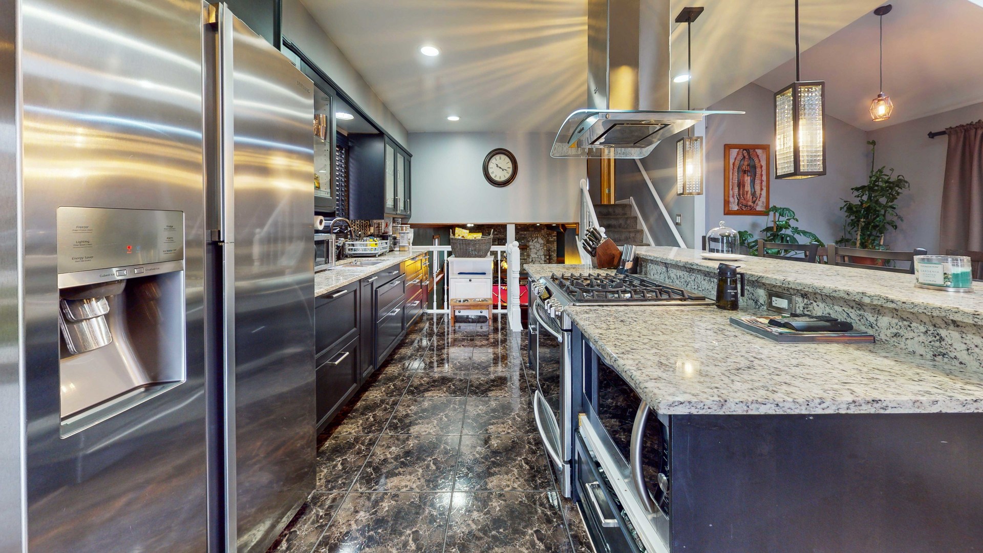 8129 45th Place Lyons, IL 60534 - Photo 10 of 45 a large kitchen with stainless steel appliances granite countertop a sink and a refrigerator