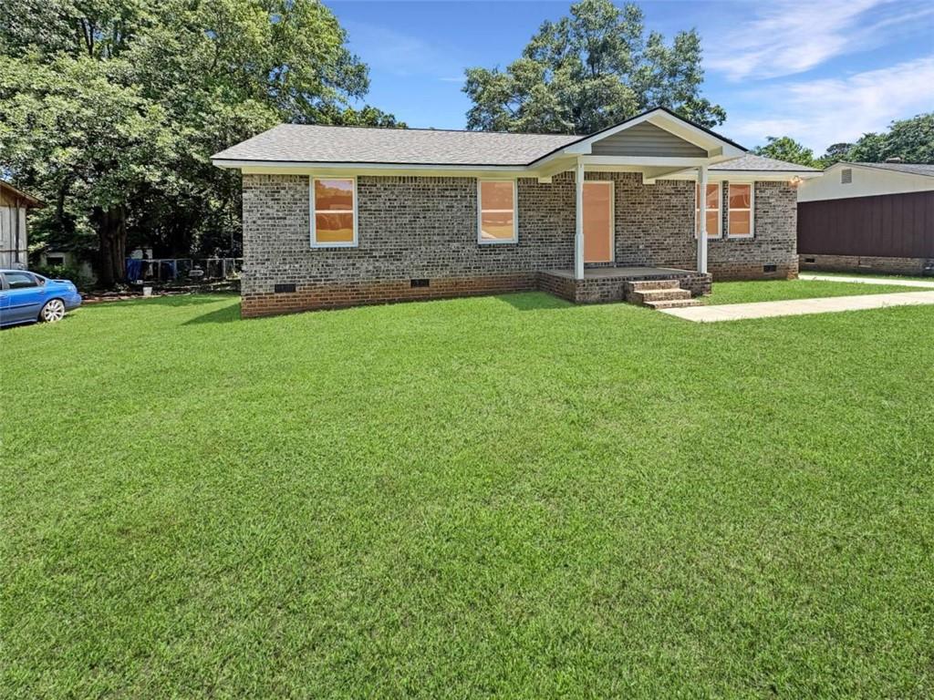 24 George Street Forsyth, GA 31029 - Photo 2 of 17 a front of a house with yard