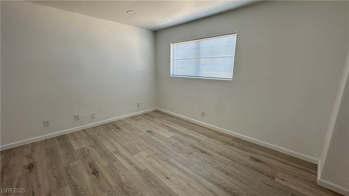 5108 Greene Lane, Unit D Las Vegas, NV 89119 - Photo 12 of 16 Spare room featuring light wood finished floors and baseboards