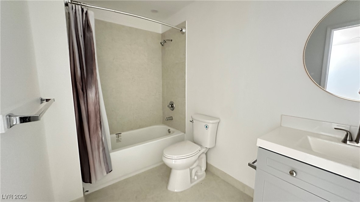 5108 Greene Lane, Unit D Las Vegas, NV 89119 - Photo 15 of 16 Bathroom with shower / bath combo with shower curtain and vanity