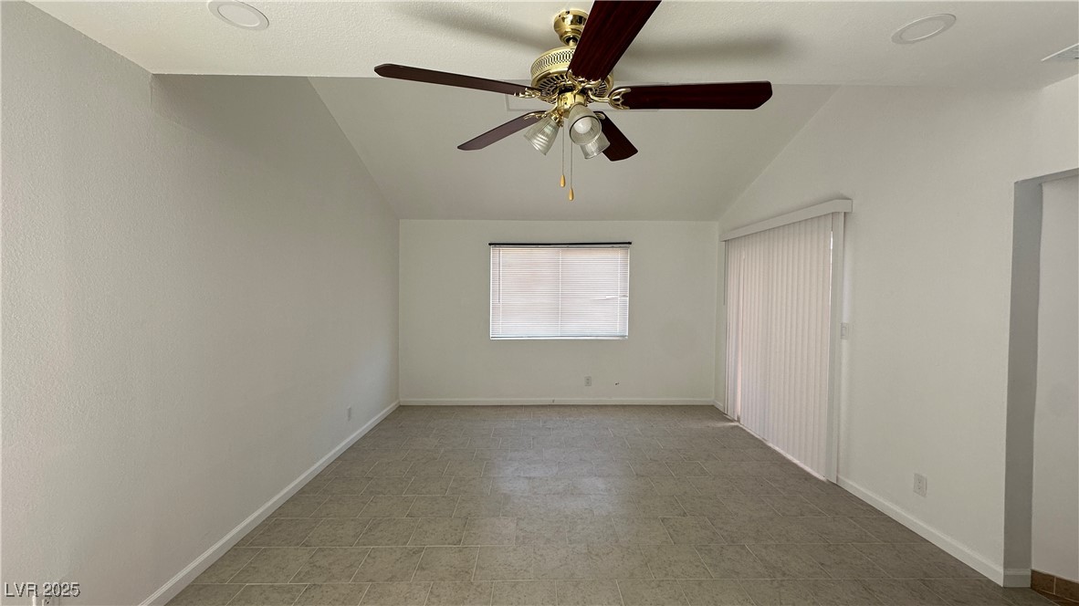 5108 Greene Lane, Unit D Las Vegas, NV 89119 - Photo 2 of 16 Unfurnished bedroom featuring lofted ceiling and a ceiling fan