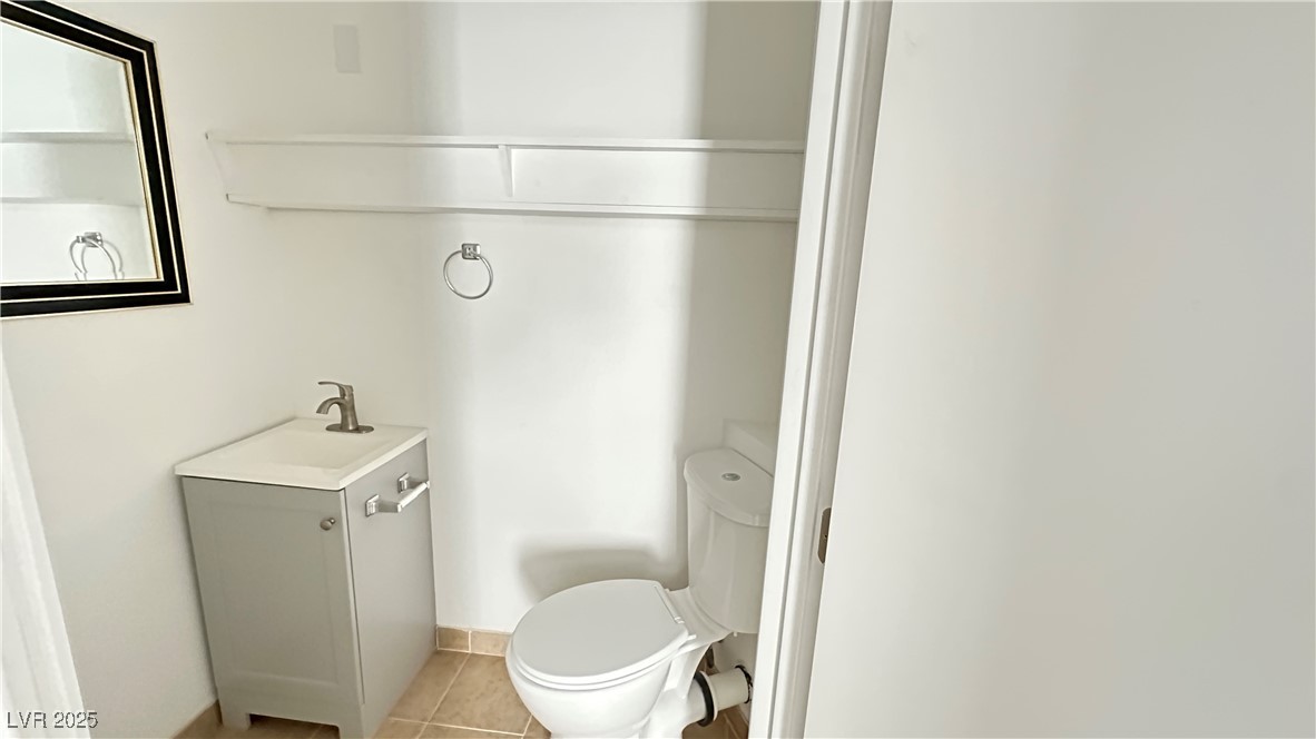 5108 Greene Lane, Unit D Las Vegas, NV 89119 - Photo 5 of 16 Bathroom with light tile patterned floors and vanity
