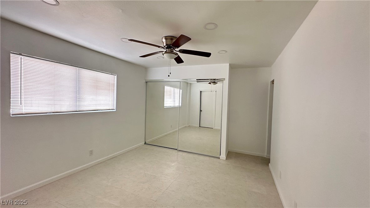 5108 Greene Lane, Unit D Las Vegas, NV 89119 - Photo 7 of 16 Unfurnished bedroom featuring a ceiling fan, a closet, and recessed lighting