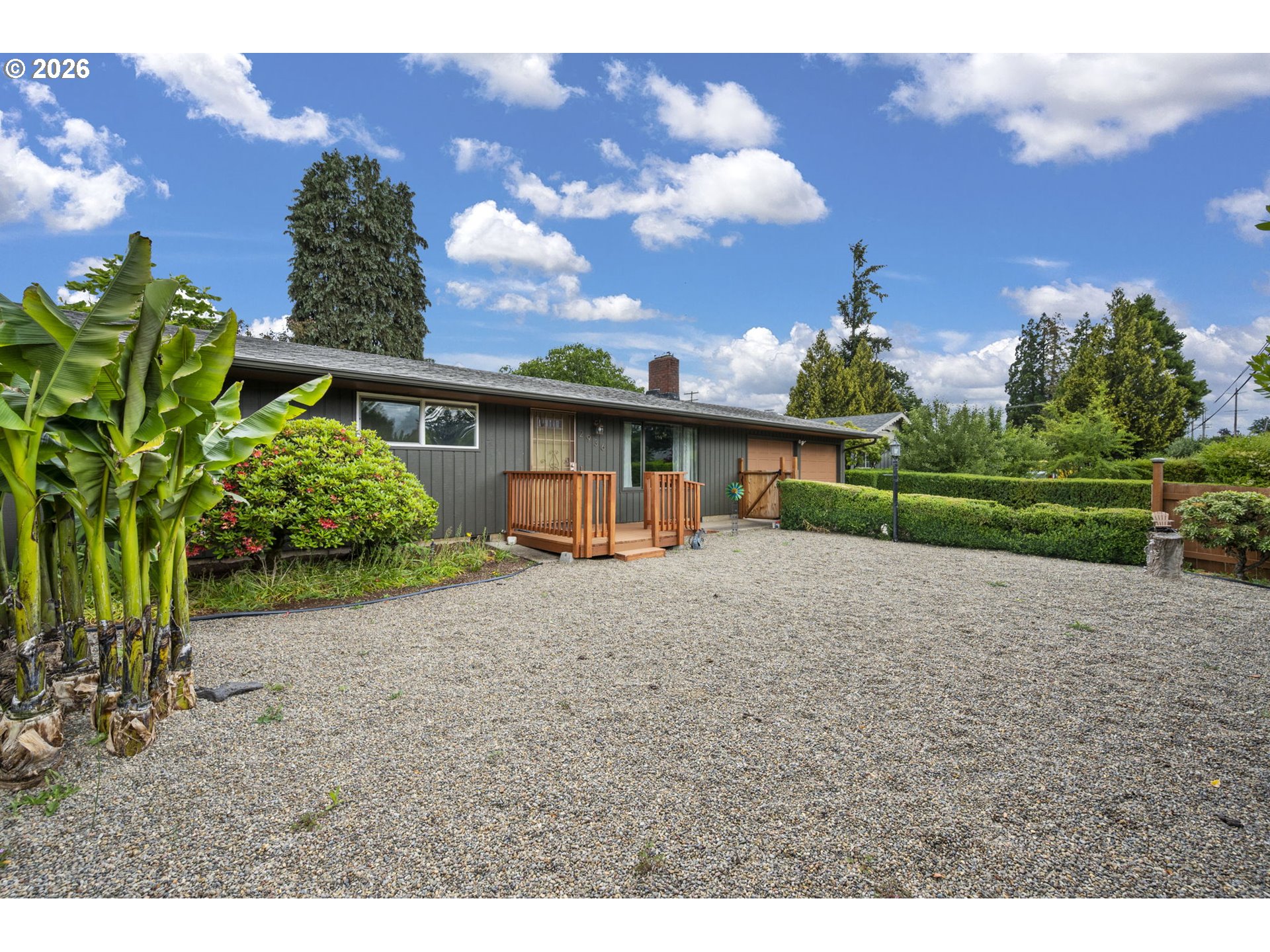 2936 Game Farm Road Springfield, OR 97477 - Photo 3 of 25 a view of a house with a yard and a large tree