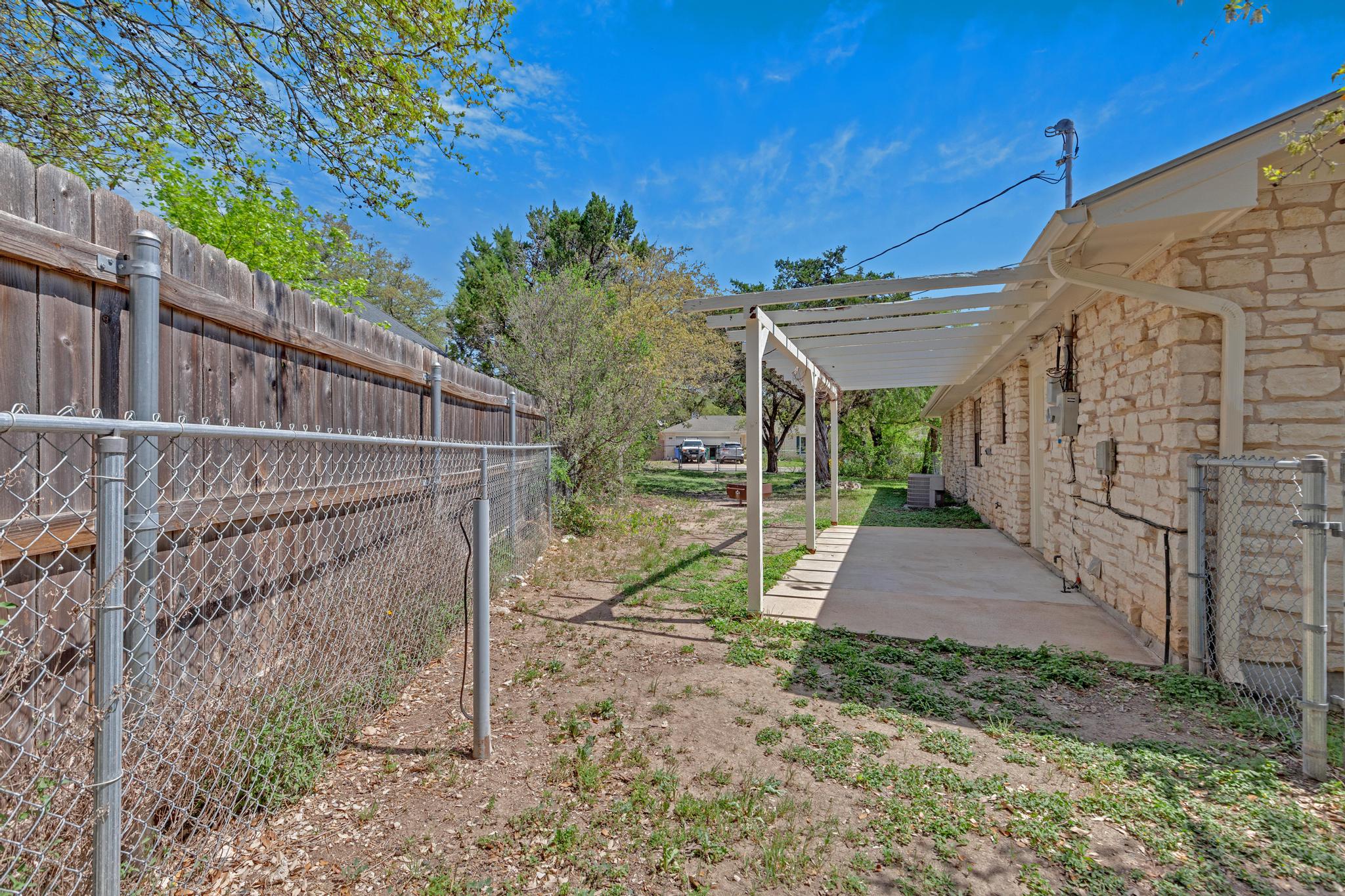 7902 Bar K Ranch Road Lago Vista, TX 78645 - Photo 32 of 35 View of fenced yard