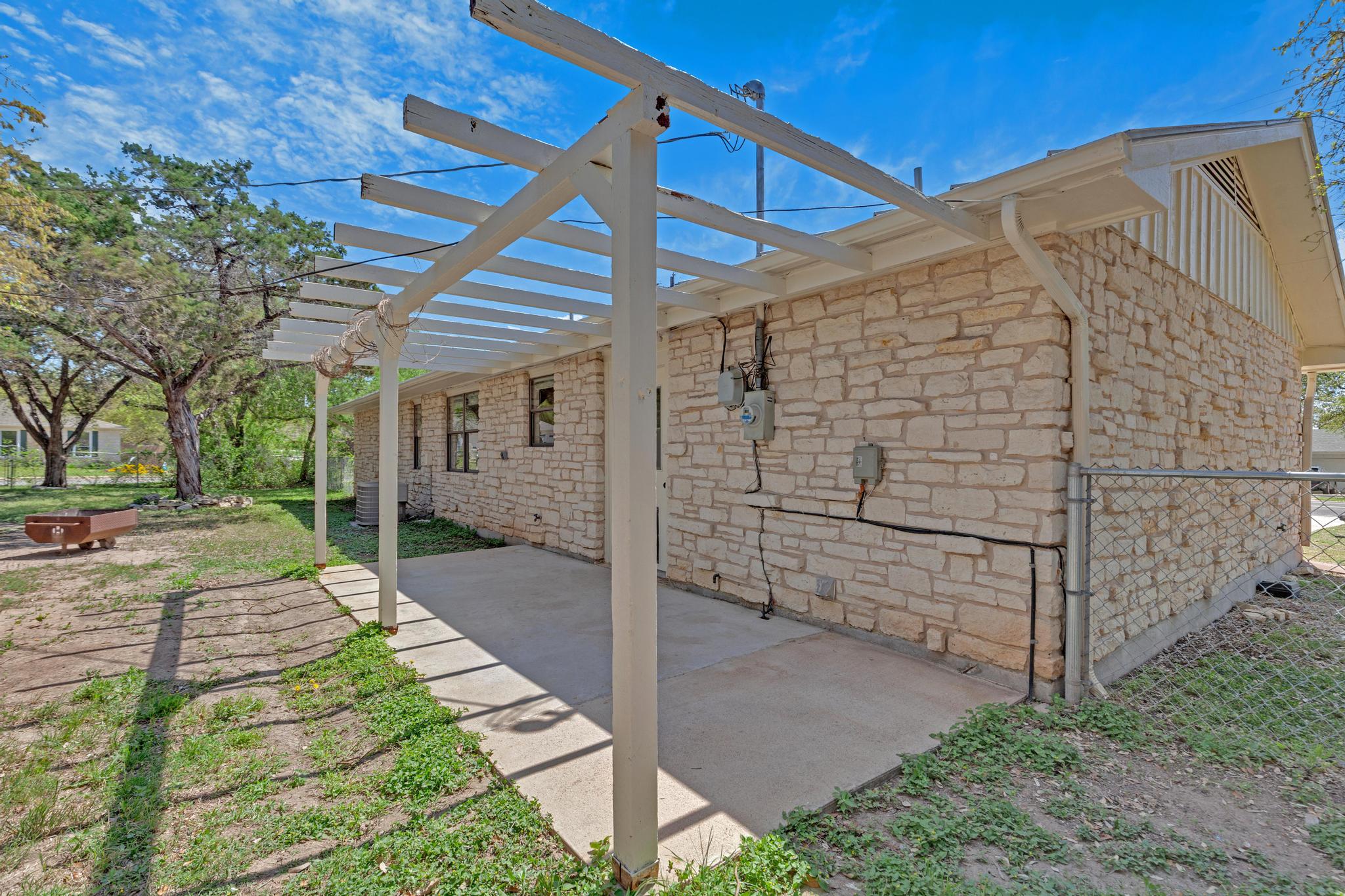 7902 Bar K Ranch Road Lago Vista, TX 78645 - Photo 33 of 35 View of patio featuring a pergola