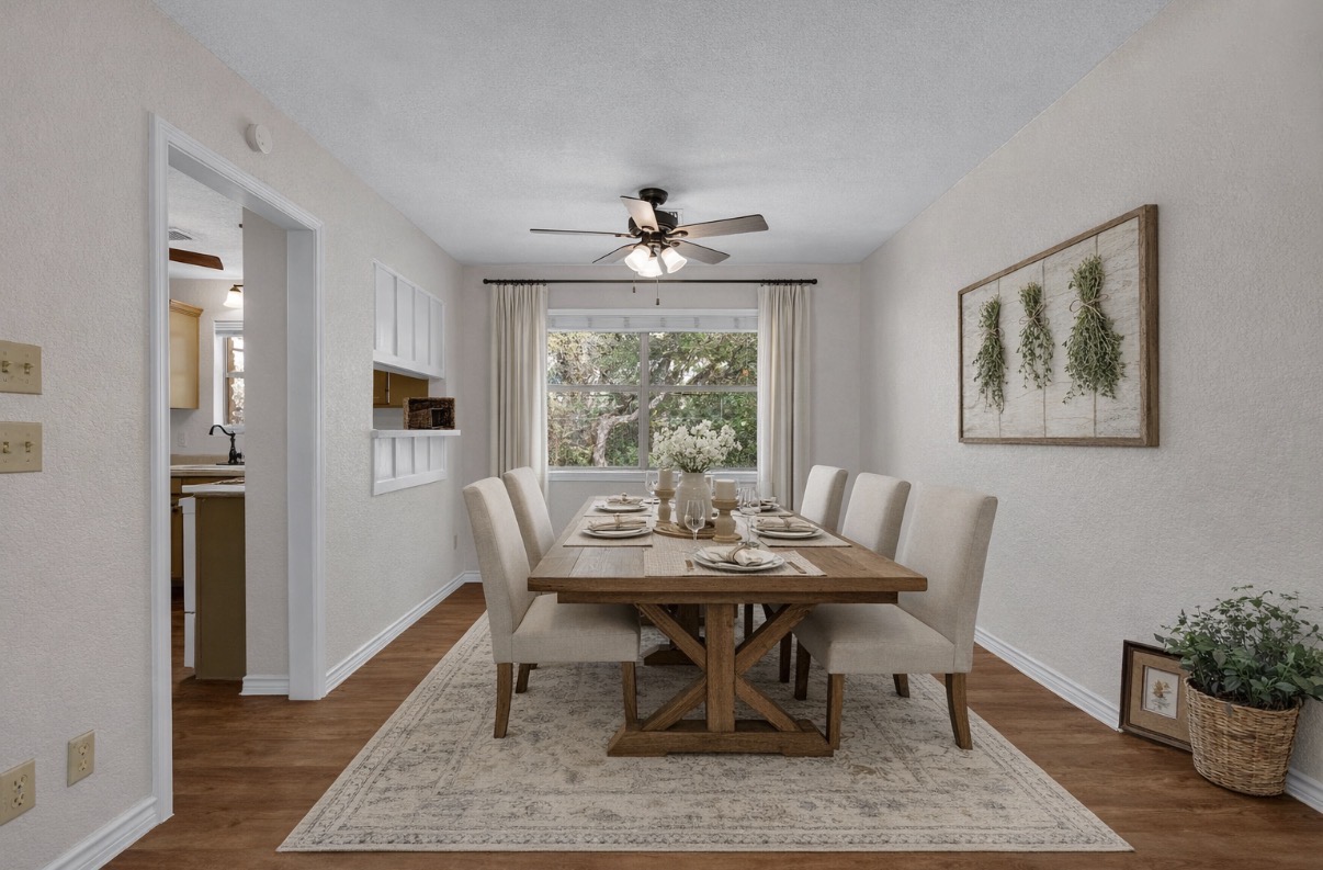 7902 Bar K Ranch Road Lago Vista, TX 78645 - Photo 7 of 35 Dining space featuring ceiling fan, wood finished floors, a textured wall, and a textured ceiling