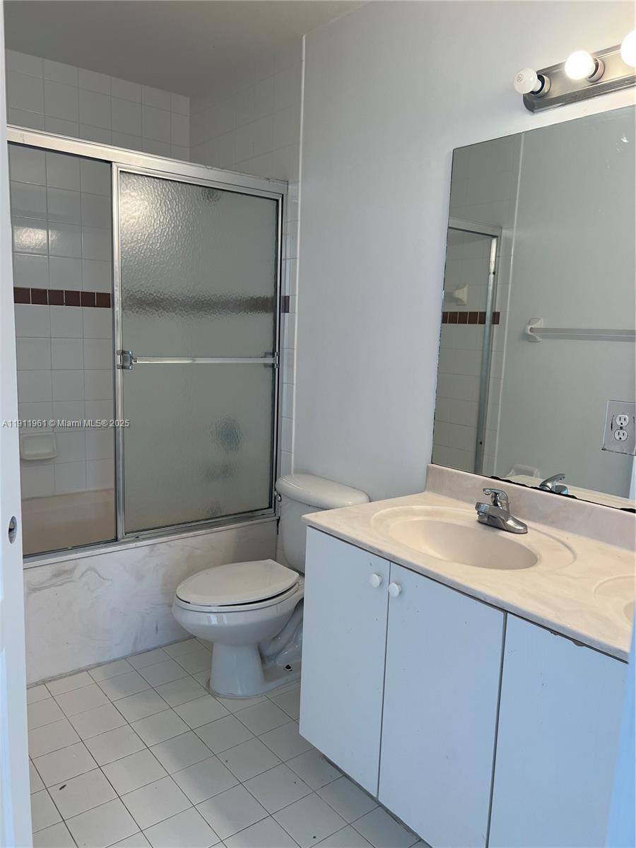 12906 Southwest 30th Street, Unit 134 Miramar, FL 33027 - Photo 11 of 13 a bathroom with a sink toilet and shower