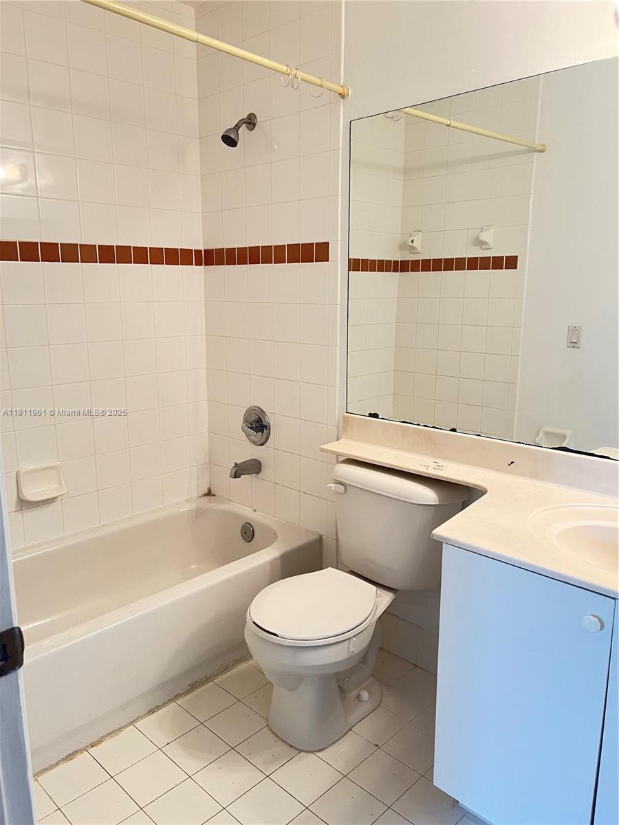 12906 Southwest 30th Street, Unit 134 Miramar, FL 33027 - Photo 10 of 13 a bathroom with a sink a toilet and a bathtub