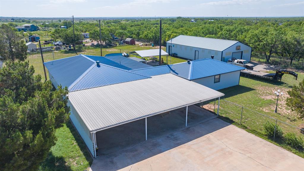 8867 Spinks Road Abilene, TX 79603 - Photo 3 of 9 parking carport, house, and shop. looking South East