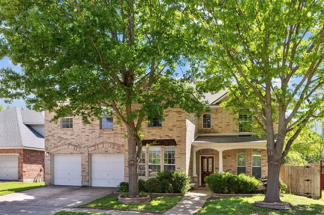 an aerial view of a house with outdoor space