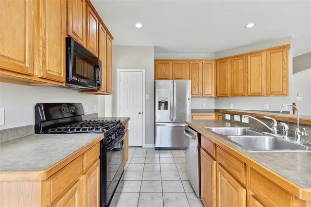 a view of an empty room with window and fireplace
