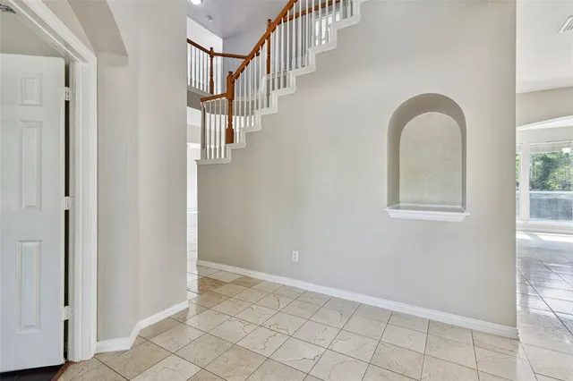 a kitchen with stainless steel appliances granite countertop a stove top oven a sink a counter top space and cabinets