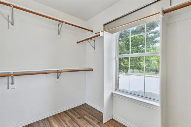 a bathroom with a double vanity sink mirror and shower