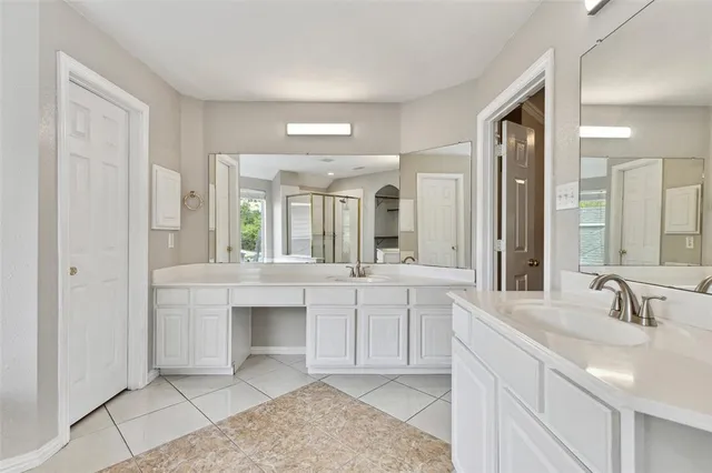 a view of a room with wooden floor and windows