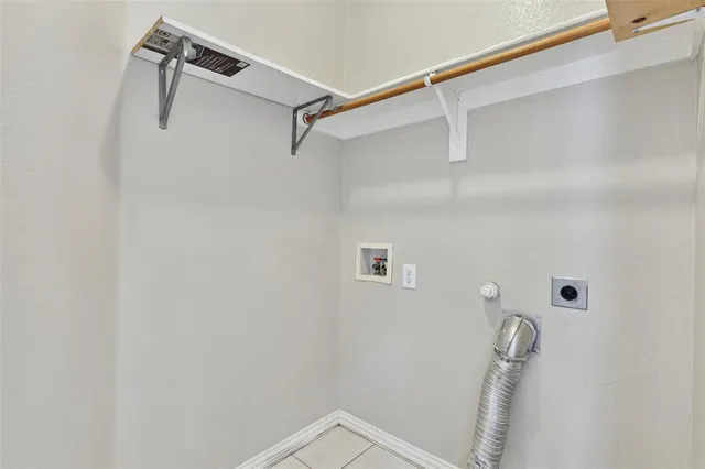 a view of room with window and wooden floor