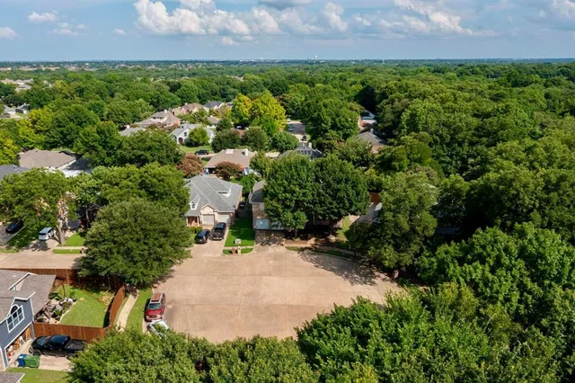 an aerial view of a house with a garden and yard
