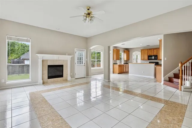 a view of an empty room with a fireplace