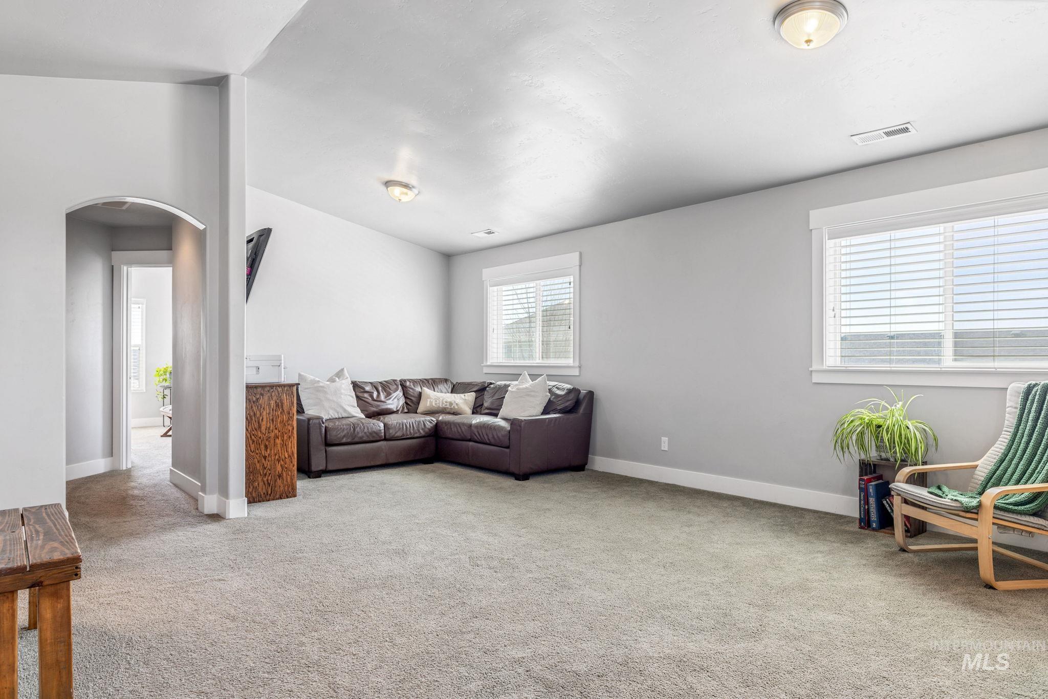 1127 Overland Trail Street Middleton, ID 83644 - Photo 12 of 24 Huge onus room with carpet and vaulted ceiling