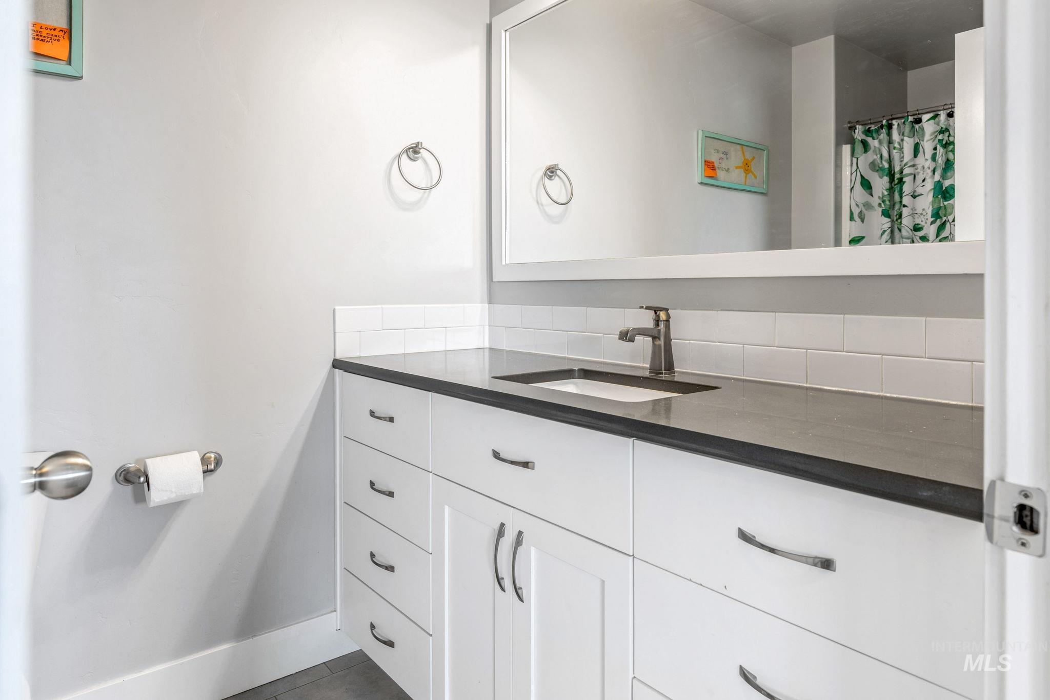 1127 Overland Trail Street Middleton, ID 83644 - Photo 13 of 24 Full bathroom with quartz countertops and tile floors