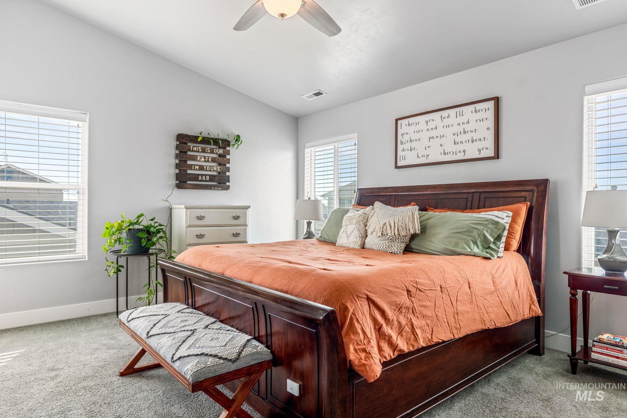 1127 Overland Trail Street Middleton, ID 83644 - Photo 14 of 24 Carpeted bedroom with vaulted ceiling and ceiling fan