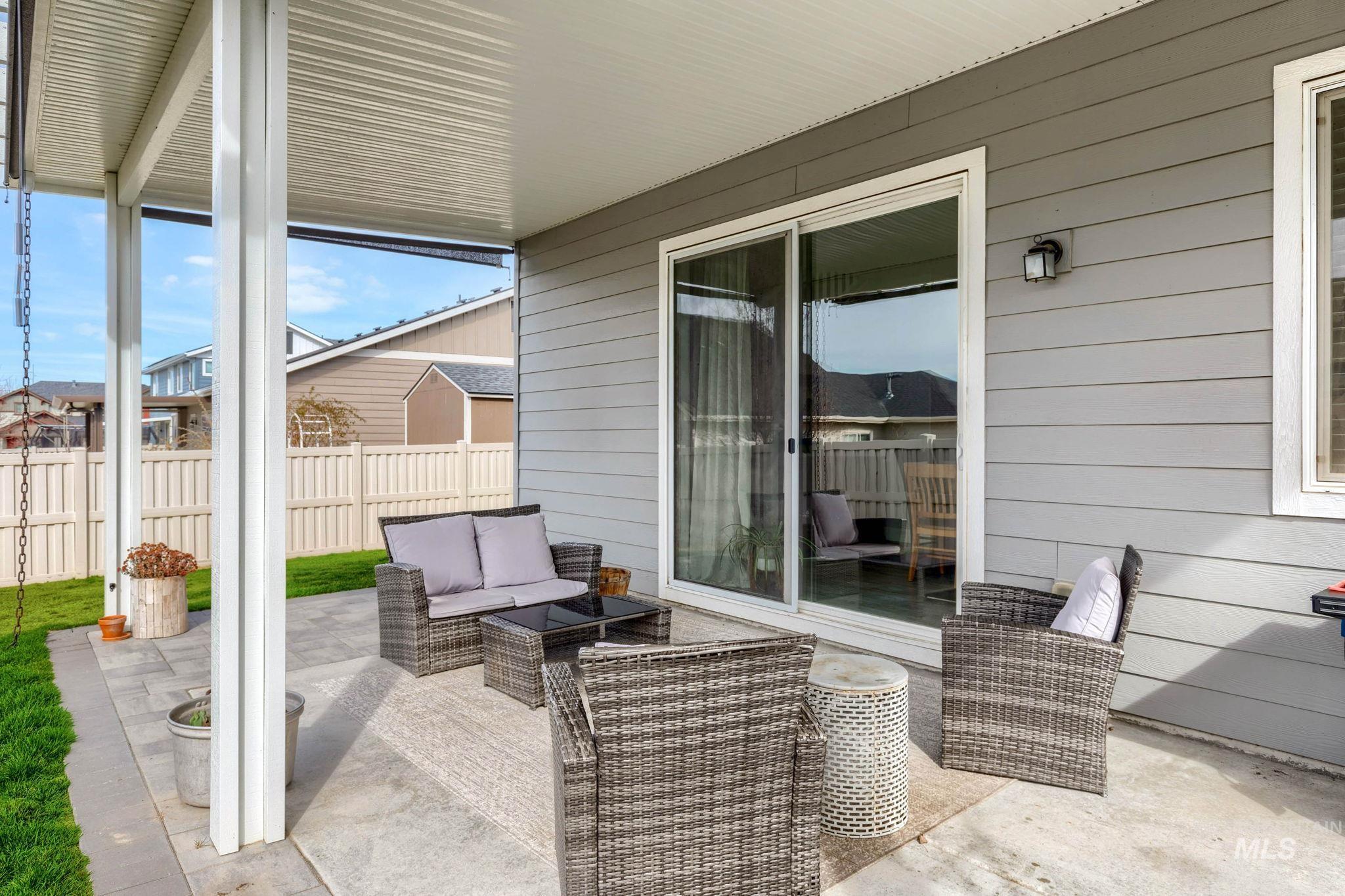 1127 Overland Trail Street Middleton, ID 83644 - Photo 21 of 24 Covered patio featuring an outdoor hangout area and roll down sun shades