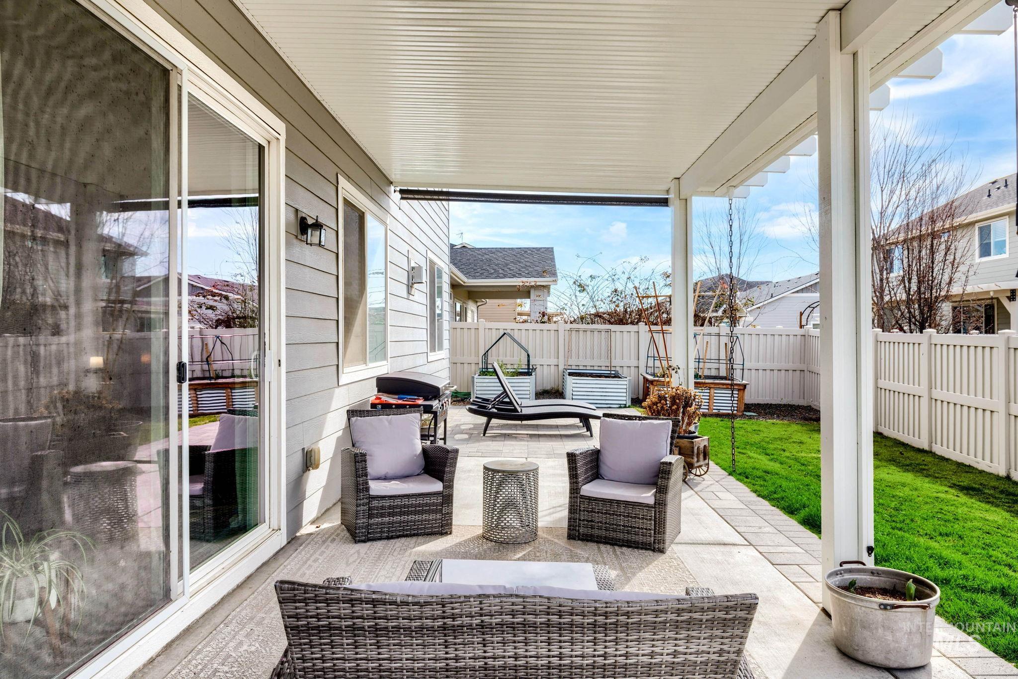 1127 Overland Trail Street Middleton, ID 83644 - Photo 22 of 24 Fenced backyard with a covered patio area, outdoor furniture, and a grill