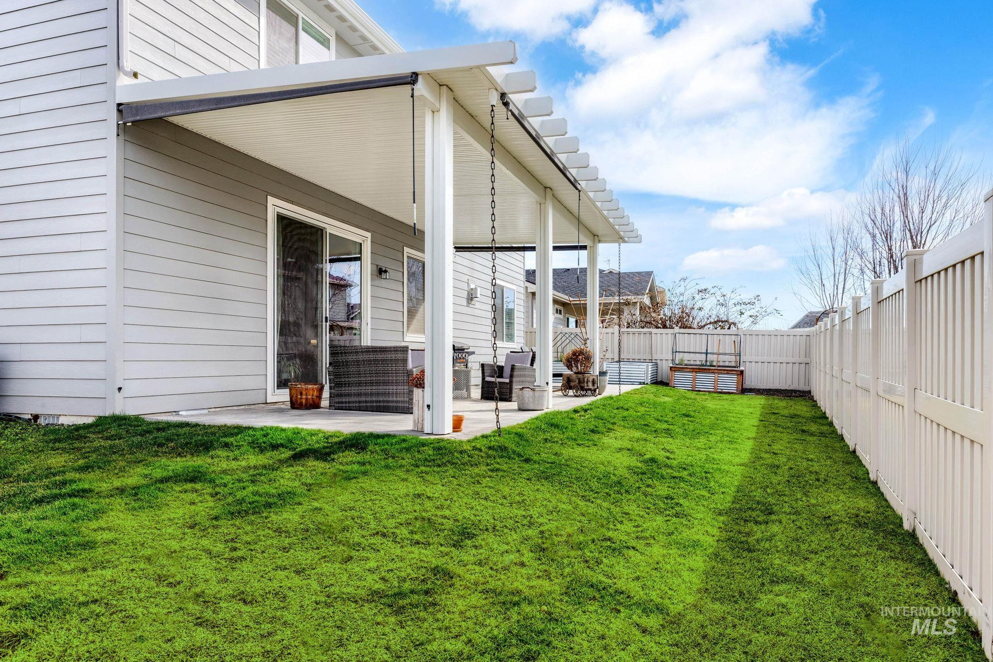 1127 Overland Trail Street Middleton, ID 83644 - Photo 23 of 24 Back of home featuring a covered patio area extended paved area with garden boxes