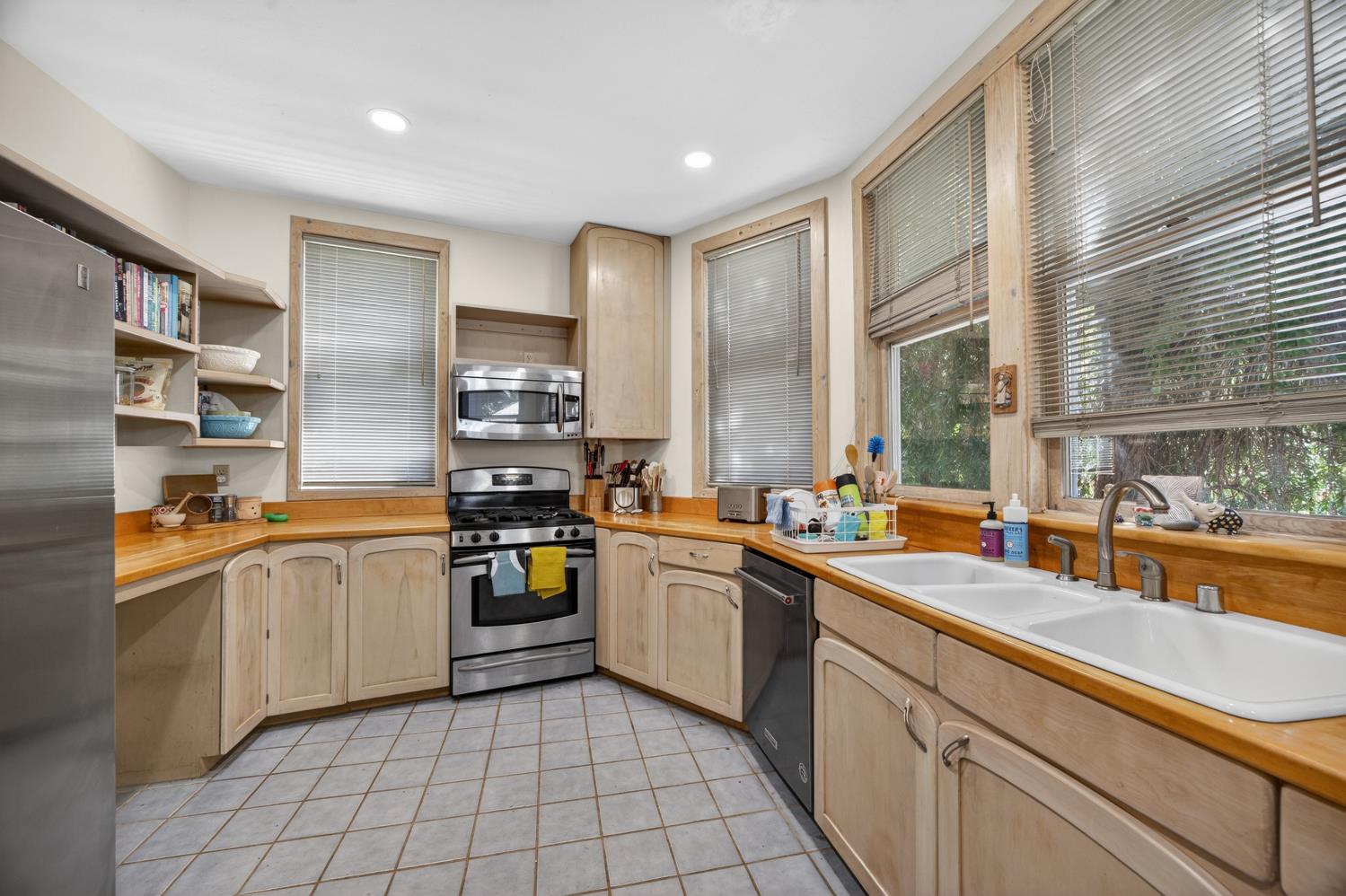 3940 Bannister Road Fair Oaks, CA 95628 - Photo 13 of 84 a kitchen with stainless steel appliances granite countertop a sink and stove top oven