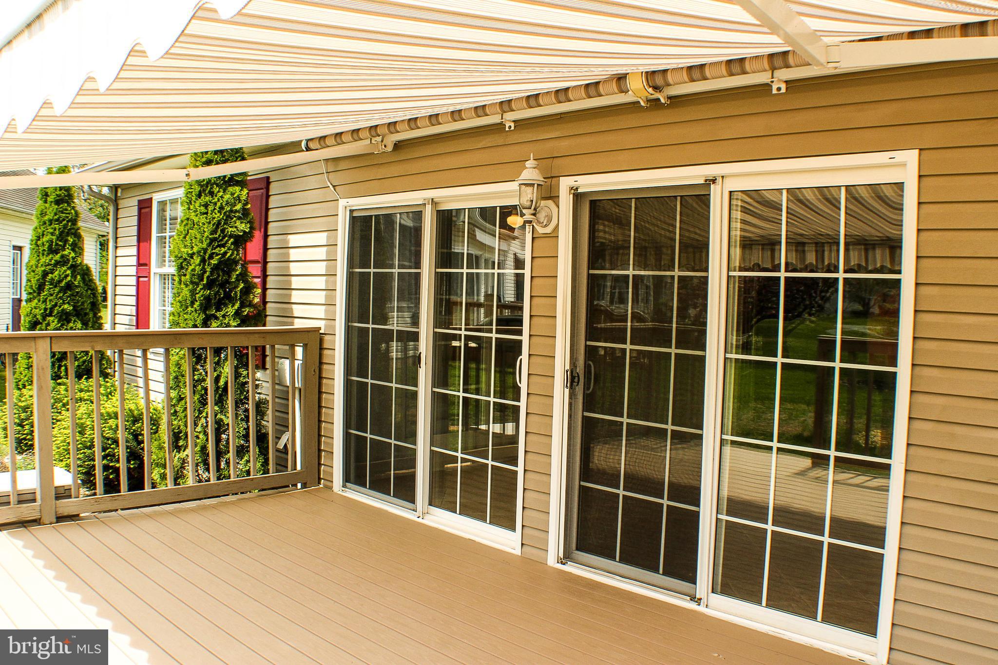 187 North Planters Lane Dover, DE 19901 - Photo 16 of 28 a view of front door with wooden floor and windows