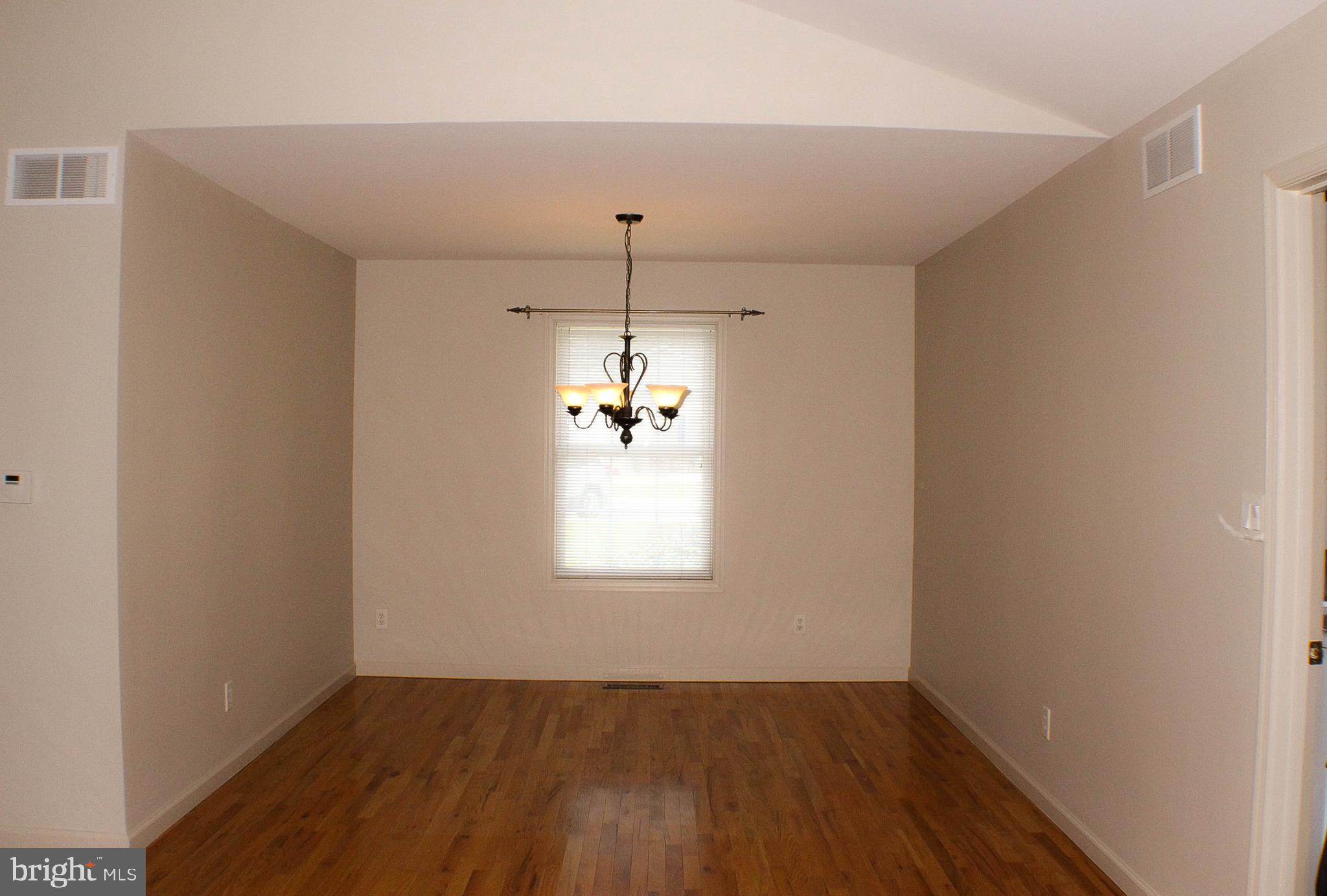187 North Planters Lane Dover, DE 19901 - Photo 20 of 28 an empty room with wooden floor and windows