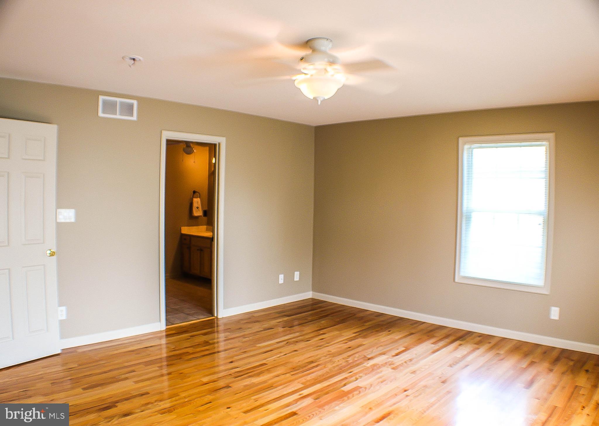 187 North Planters Lane Dover, DE 19901 - Photo 23 of 28 a view of empty room with wooden floor and fan