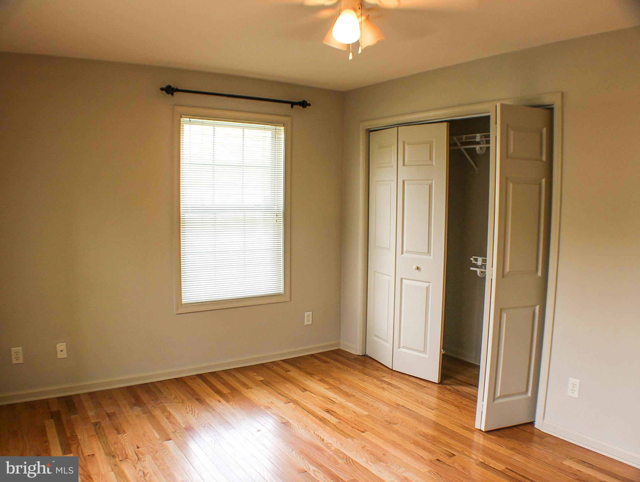 187 North Planters Lane Dover, DE 19901 - Photo 26 of 28 a view of an empty room with wooden floor and a window