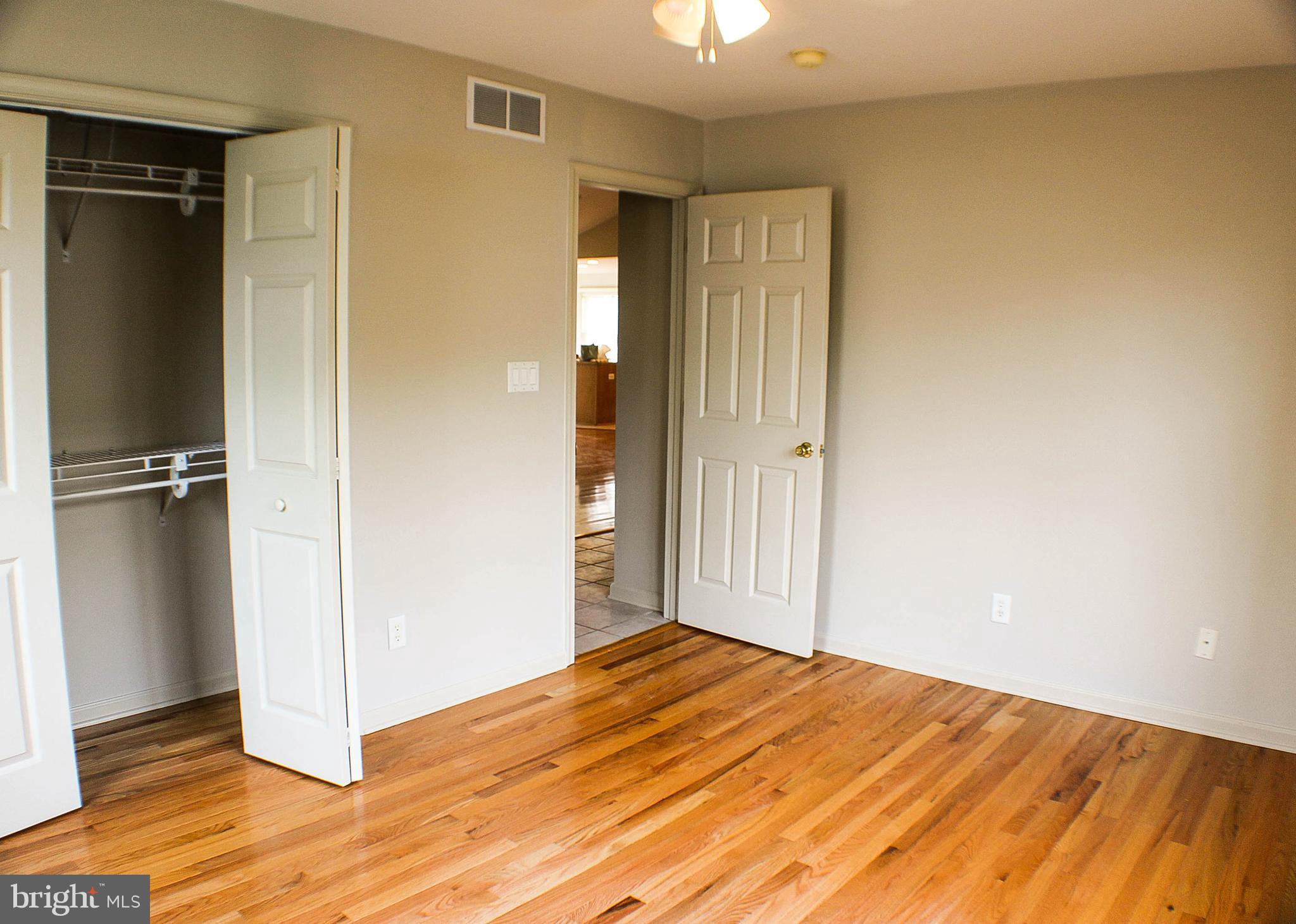 187 North Planters Lane Dover, DE 19901 - Photo 27 of 28 an empty room with wooden floor and closet