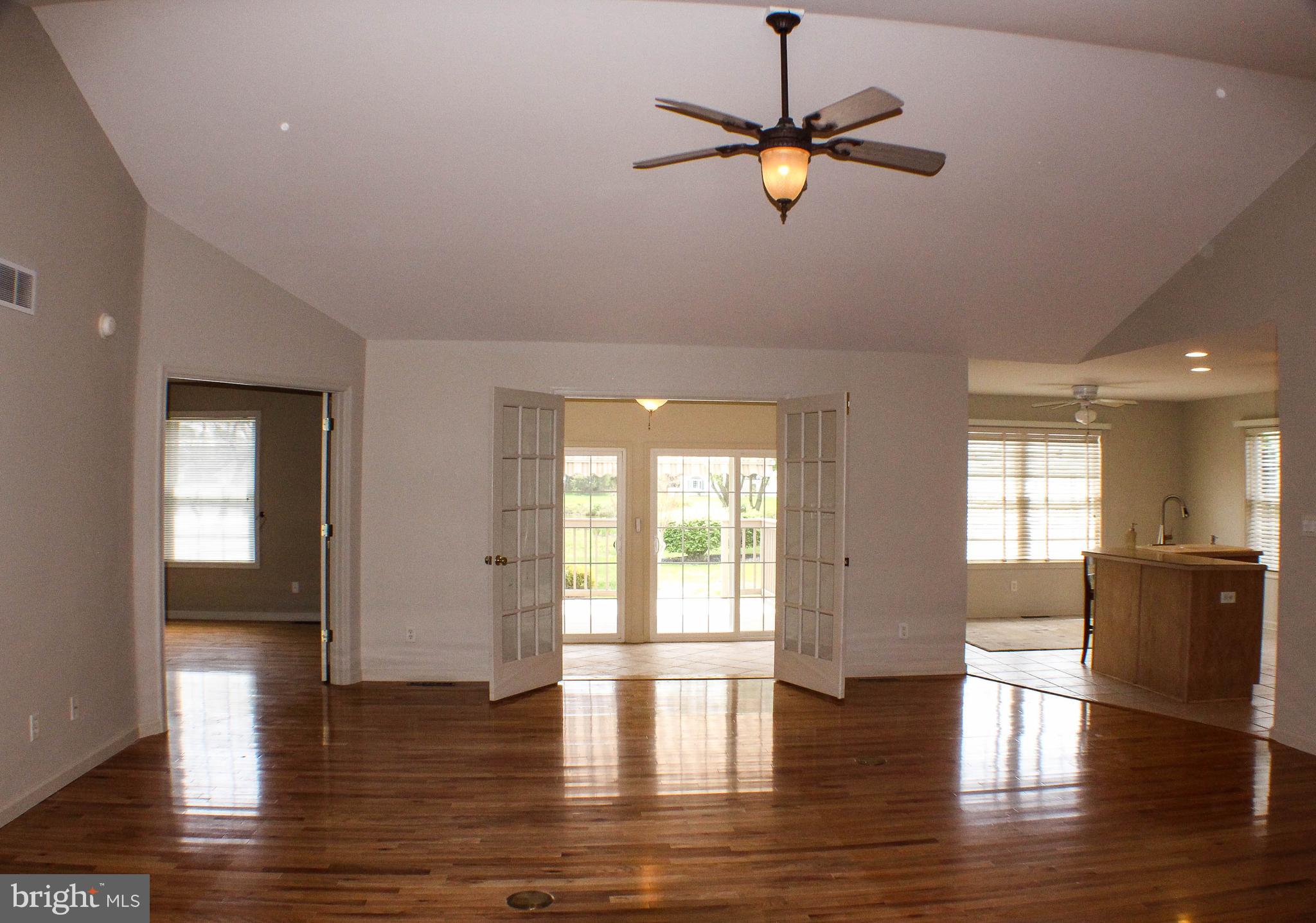 187 North Planters Lane Dover, DE 19901 - Photo 9 of 28 a view of empty room with wooden floor and fan