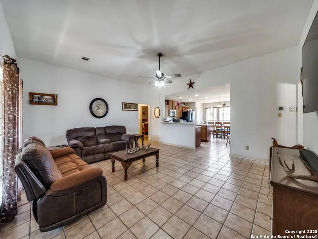 a living room with furniture and a clock