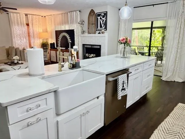 a kitchen with a stove and a white cabinets