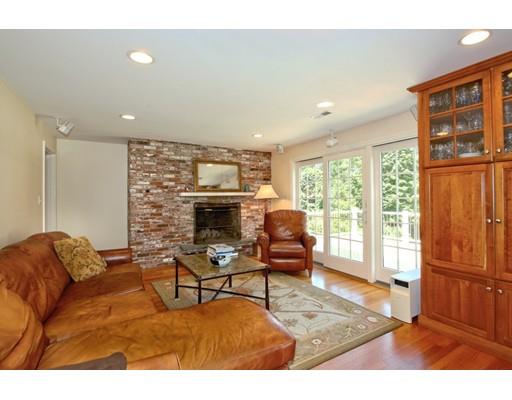 855 Boston Post Road Weston, MA 02493 - Photo 6 of 18 a living room with furniture a rug and a fireplace