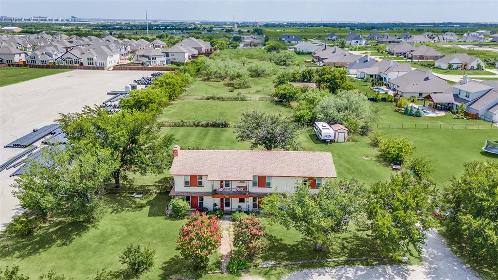 16777 John Wiley Road Justin, TX 76247 - Photo 3 of 16 an aerial view of a house with garden space and outdoor seating