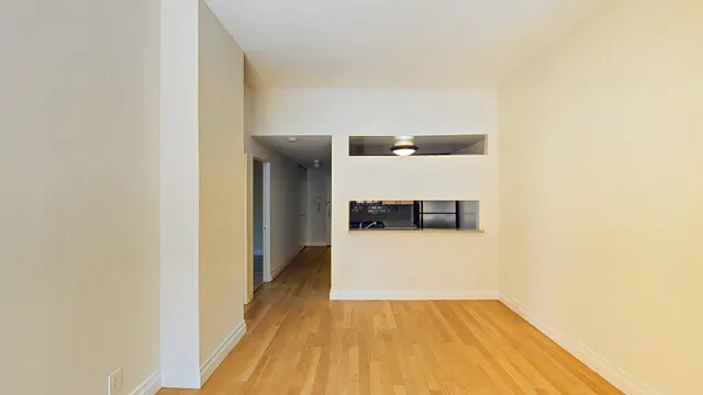 a picture of a building with a white wall