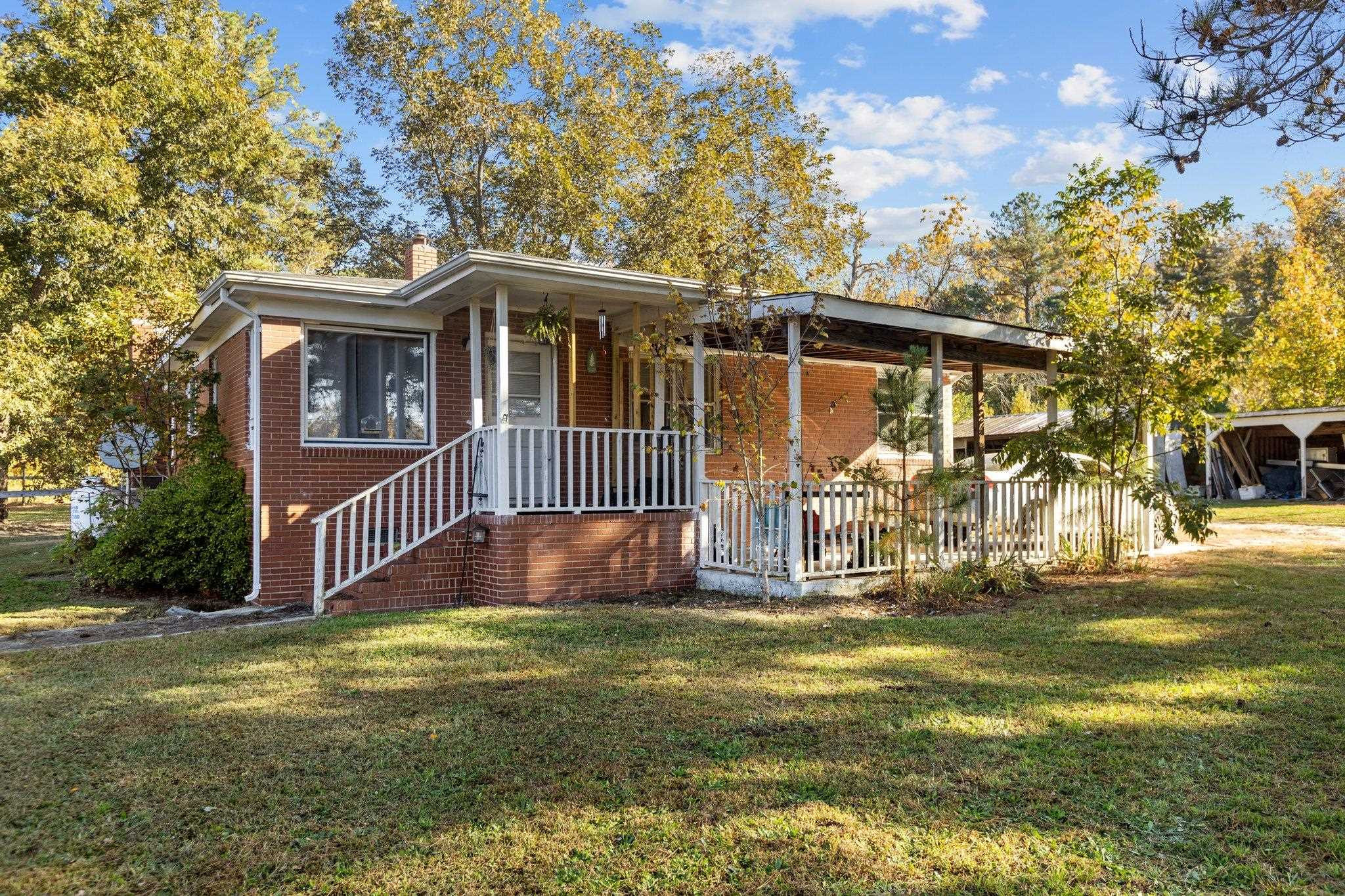 3605 Buzzard Road Wendell, NC 27591 - Photo 1 of 25 a front view of a house with garden