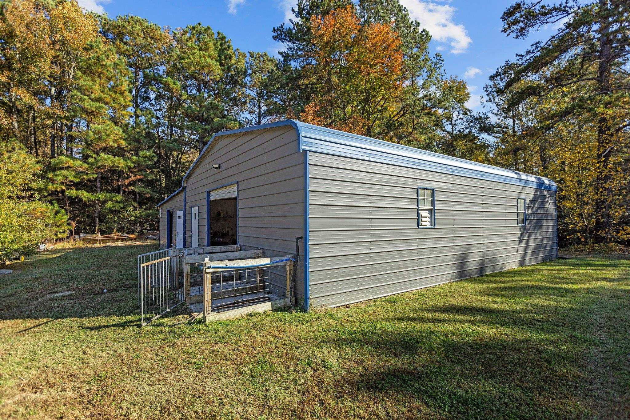 3605 Buzzard Road Wendell, NC 27591 - Photo 2 of 25 a view of backyard with barbeque oven and trees