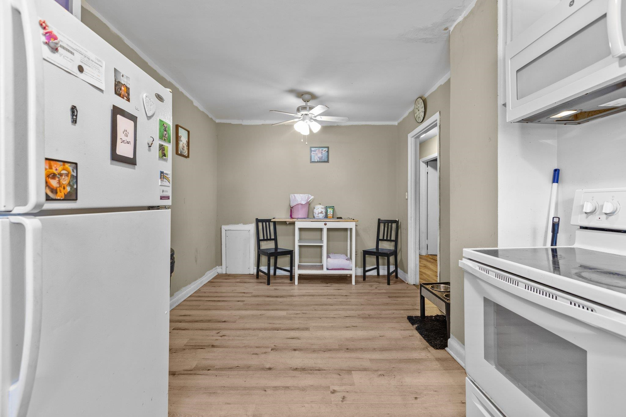 3605 Buzzard Road Wendell, NC 27591 - Photo 6 of 25 a living room with stainless steel appliances furniture a chandelier and a view of kitchen