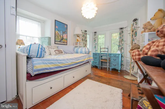 a bedroom with a bed and a table