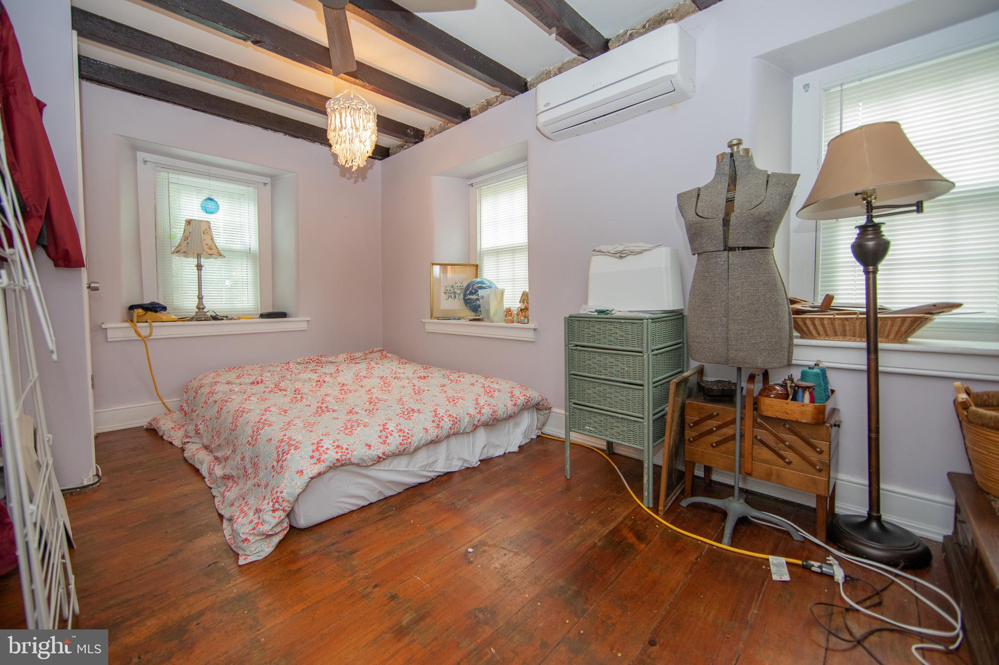 4 Seminary Road Glenmoore, PA 19343 - Photo 13 of 35 a bedroom with a bed and wooden floor